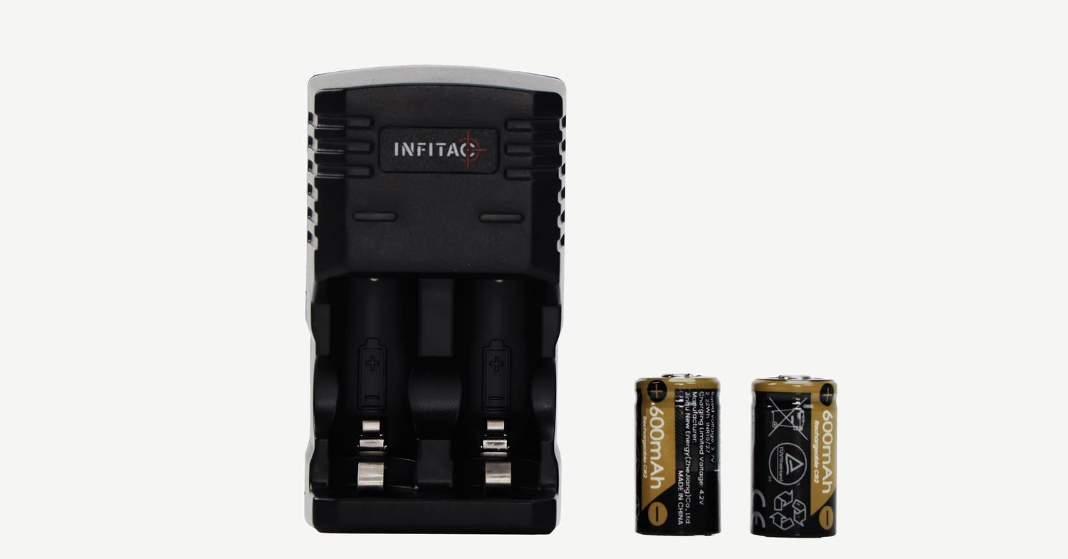 An INFITAC dual-slot battery charger is shown out of its packaging, with the two included 600mAh rechargeable CR2 batteries set beside it against a plain background.
