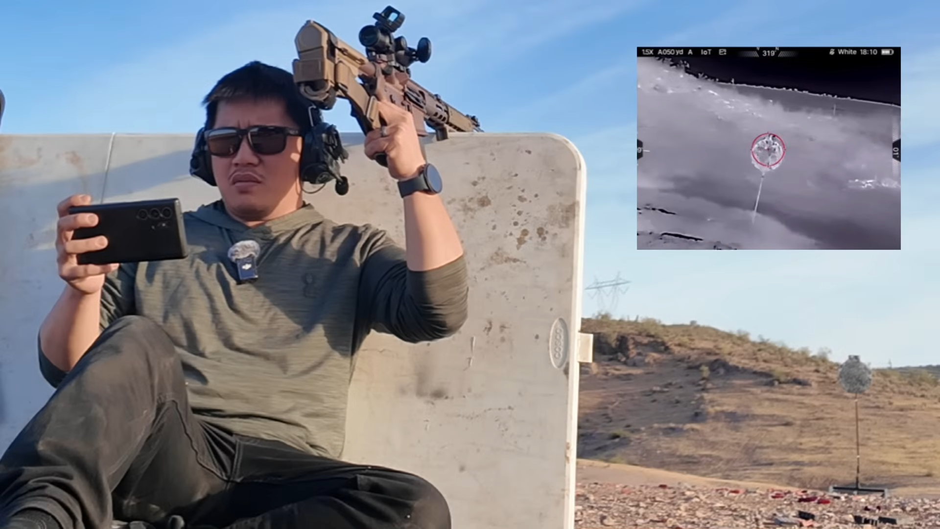 Man holding smartphone with IOTS IOP13 thermal scope and rifle, inset shows thermal target detection