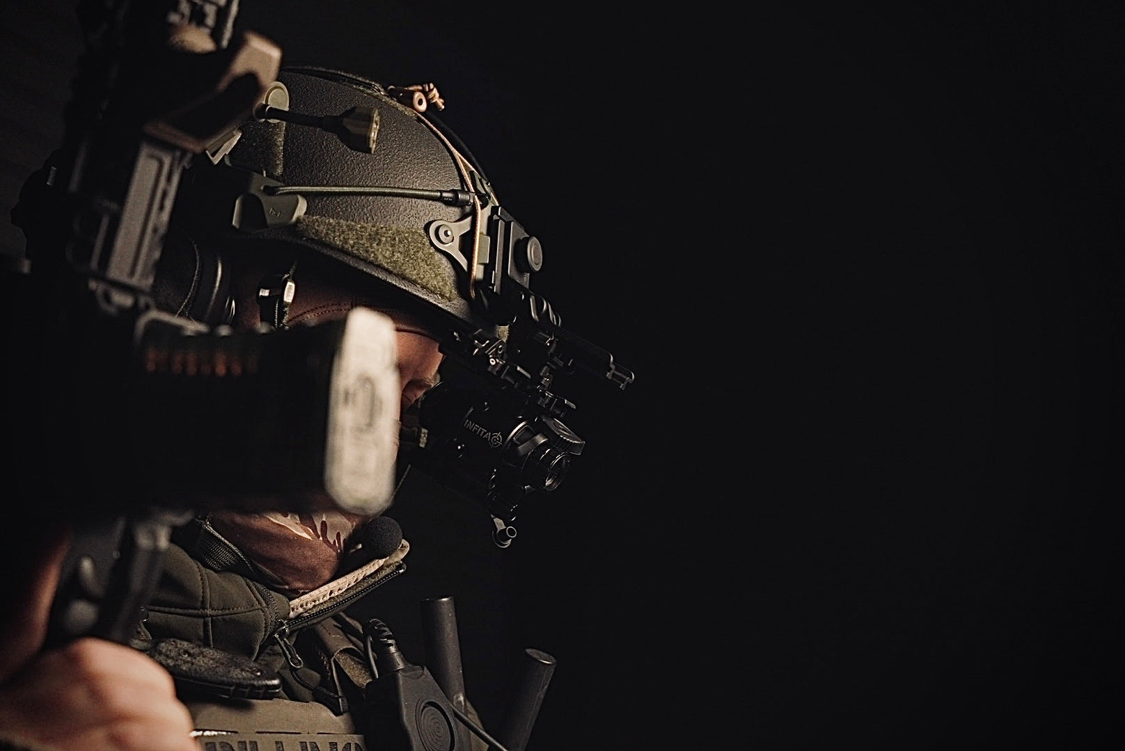 Soldier with Infita night vision goggles and tactical helmet